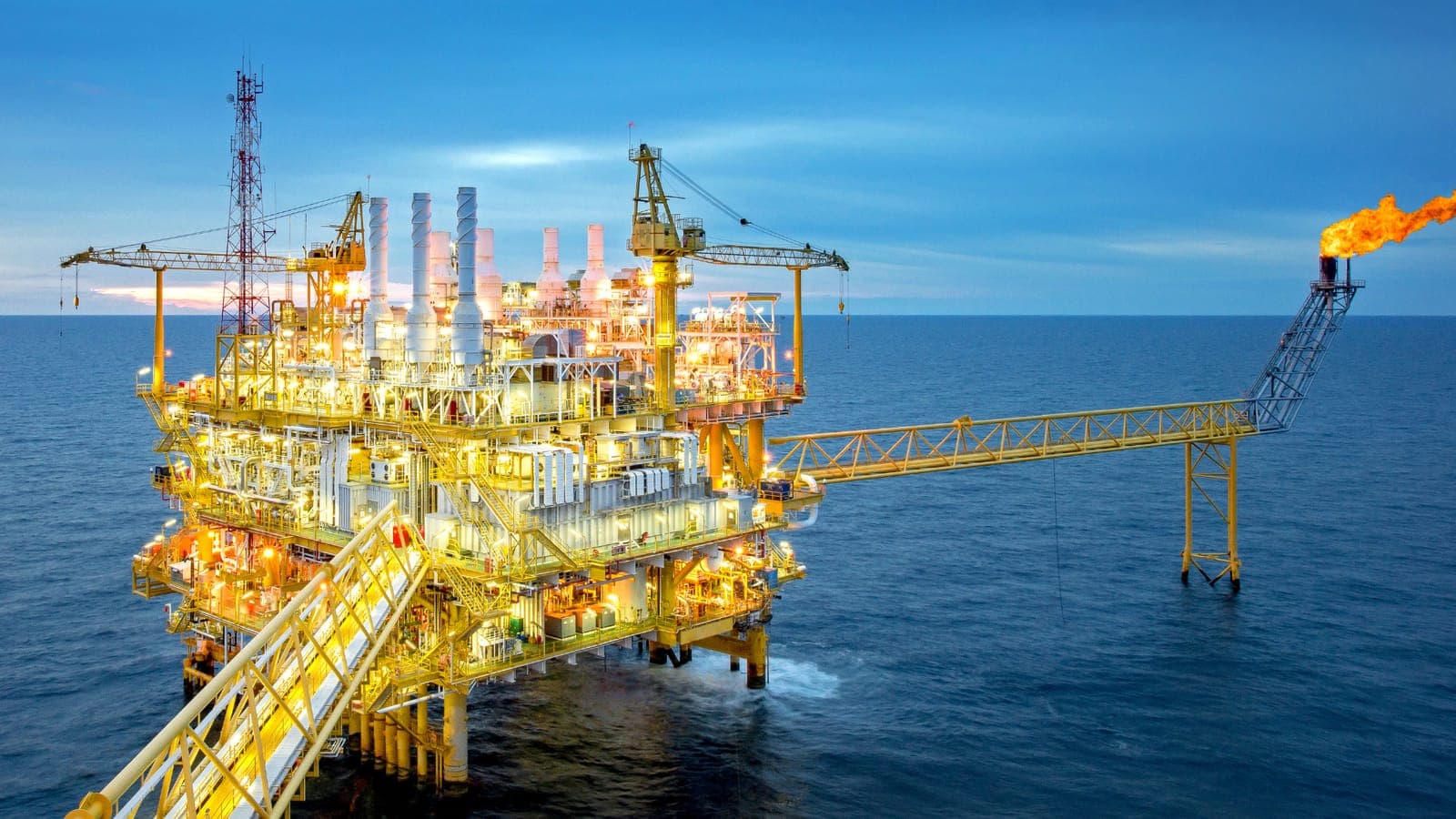 An offshore oil platform at dusk